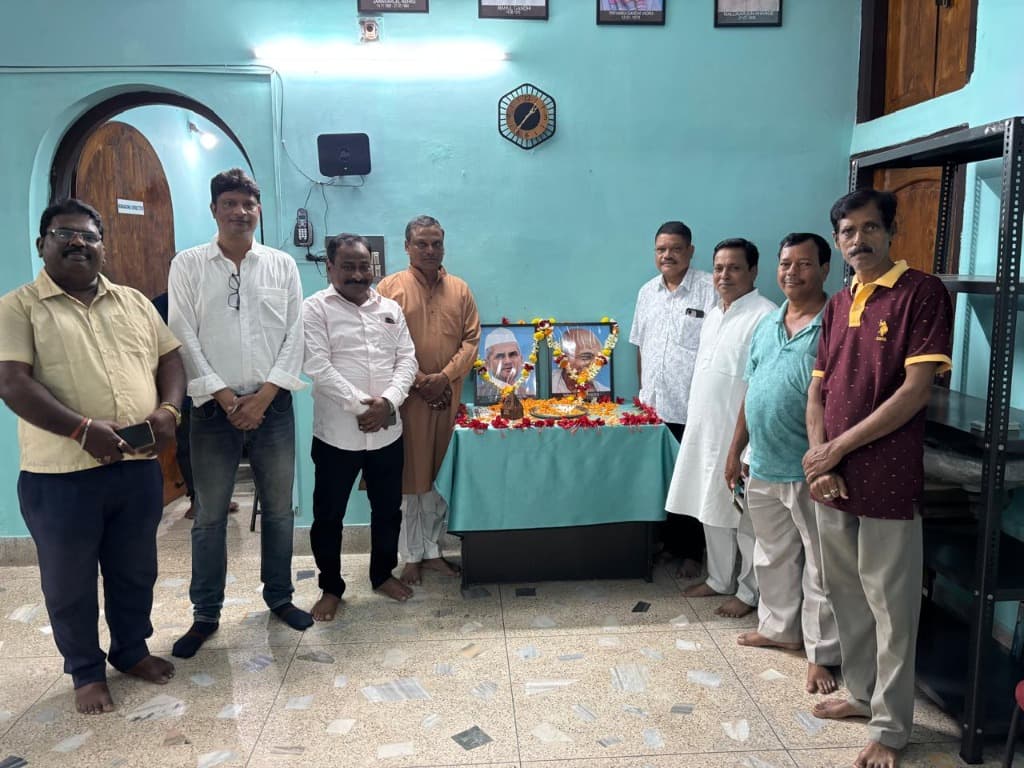BBM members and organizers gathered around tribute table during Gandhi and Shastri Jayanti